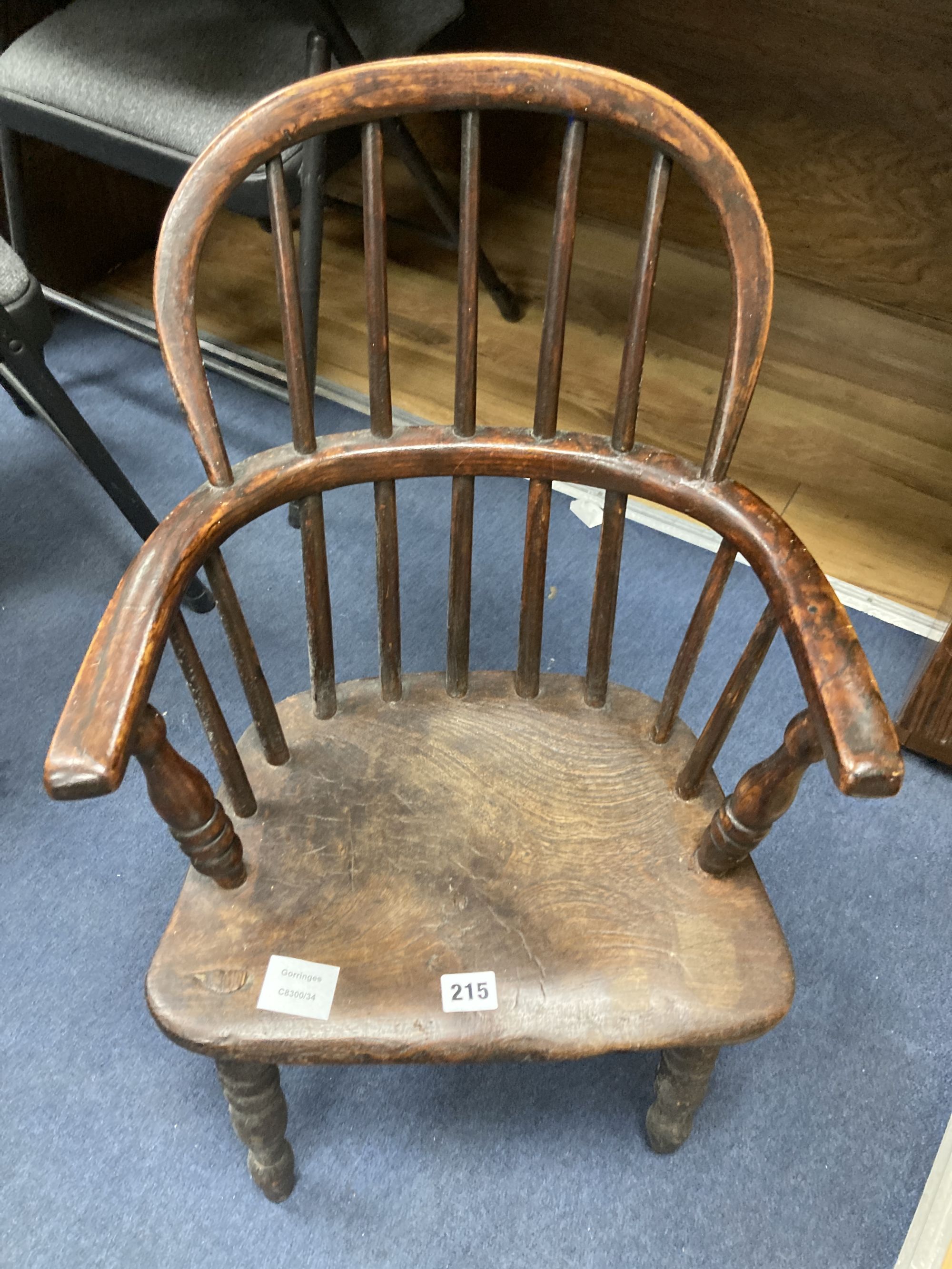 A 19th century elm and fruitwood childs Windsor elbow chair, width 40cm depth 30cm height 64cm